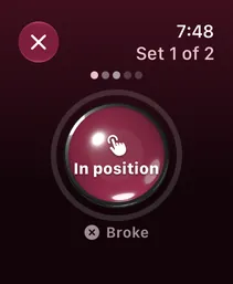 A hold rep on Apple Watch: set 1 of 2, a big In position button, and Broke below it.